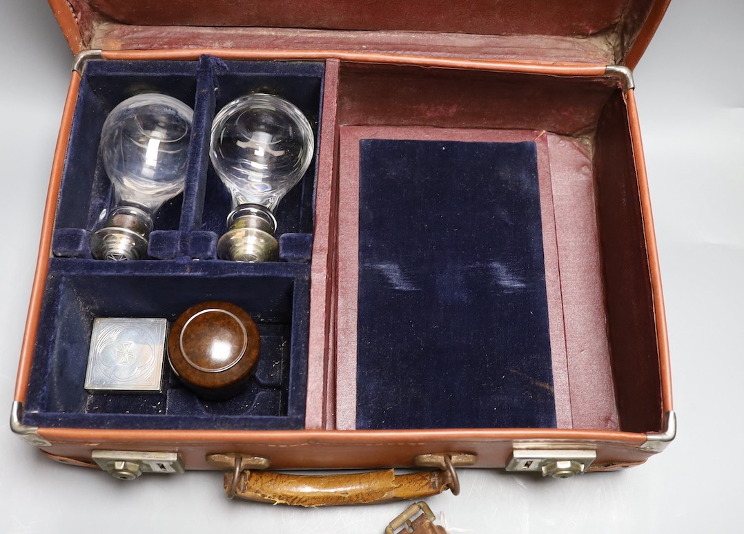 Three cased communion sets together with a mahogany box of slides